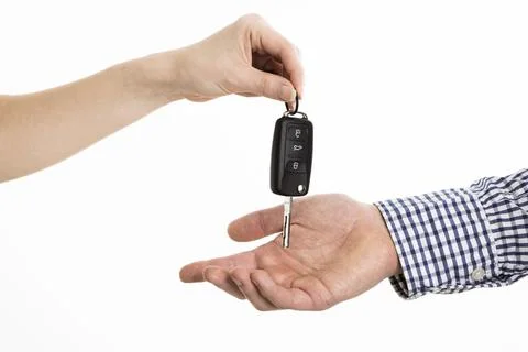 Hands exchanging car keys. High quality photo Stock Photos