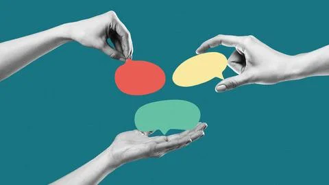 Hands exchanging speech bubbles in a creative discussion about news and ideas Stock Photos