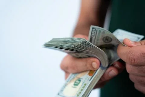 Hands exchanging stack of money Stock Photos
