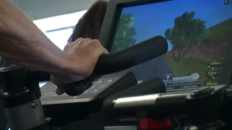 Hands on Exercise Bike with Video Screen 스톡 동영상 7728155