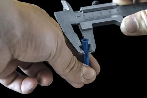 Hands of an experienced engineer measure Stock Photos