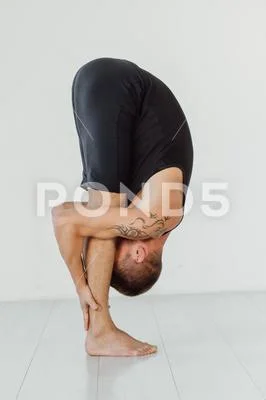 Hands to feet pose. Standing forward fold yoga pose.
