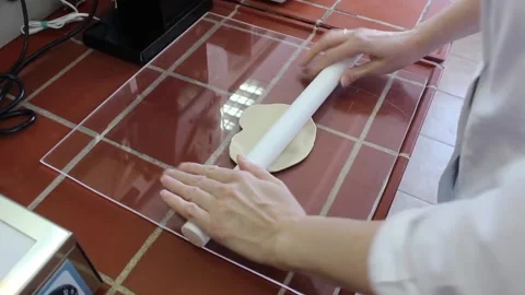 Hands of a female laboratory assistant roll out the biological material Stock Footage 128374594