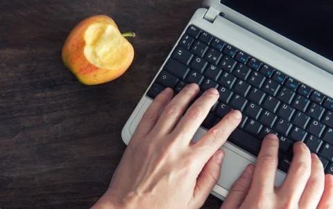 Hands female lying on the computer Stock Photos