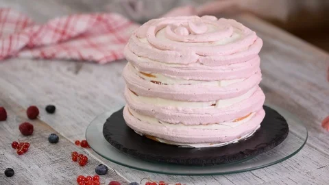 Hands of female pastry chef making delicious cake of sponge layers and a whipped Stock Footage 114691917