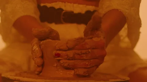 Hands of a female potter Stockbeeldmateriaal 235560257