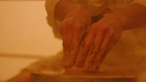 Hands of a female potter Stock Footage 235560593