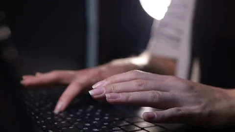 Hands of a female programmer typing text on a computer Stock Footage 130897363