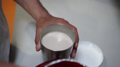 Hands fill the protein with a measuring cap in a glass. Close up Stock Footage 132172087