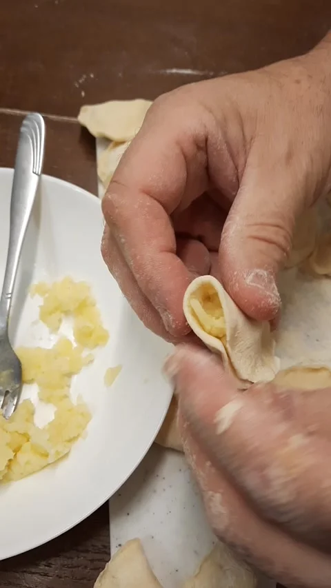 Hands filling making potato dumplings Stock Footage 328451509