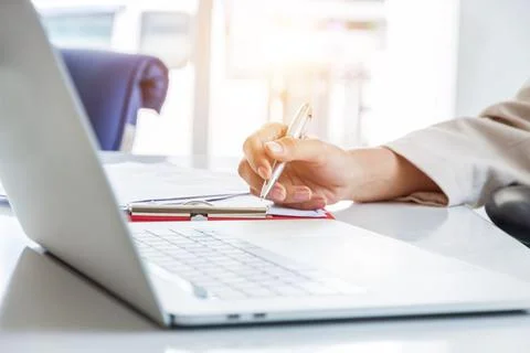 Hands of financial manager taking notes when working on report, Women working Stock Photos