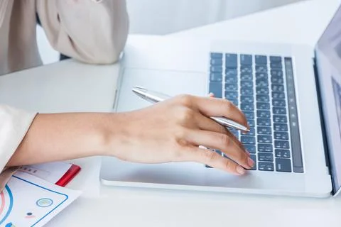 Hands of financial manager taking notes when working on report, Women working Stock Photos