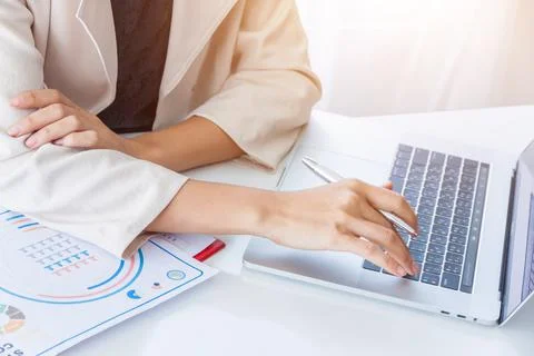 Hands of financial manager taking notes when working on report, Women working Stock Photos