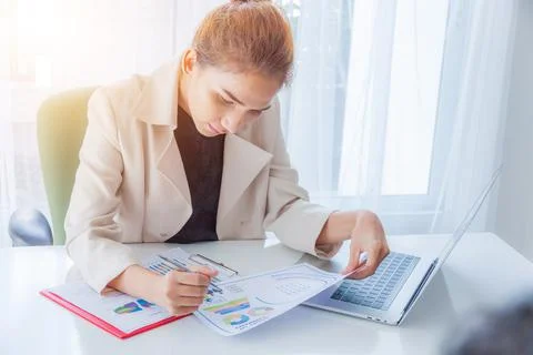 Hands of financial manager taking notes when working on report, Women working Stock Photos