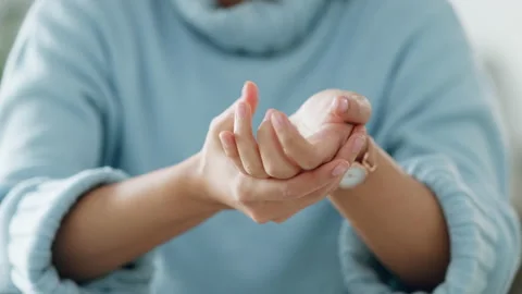 Hands, fingers and knuckle cracking of woman with carpal tunnel, wrist pain and Stock Footage 212346024