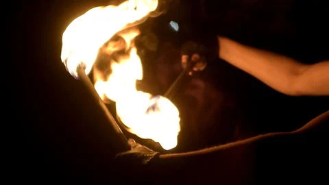 Hands of fireartist playing with fire Stock Footage 128971723