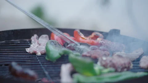 Hands flipping the meat on the barbeque grill - unrecognizable man Video stock 209515043