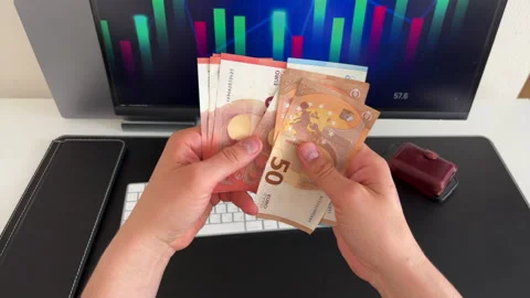 Hands Flipping Through Euro Banknotes in Trading Office Video stock 308287392