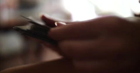 Hands flipping through old photos close up side view woman's hands Stock Footage 205535367