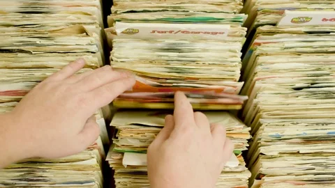 Hands Flipping through Records Stock Footage