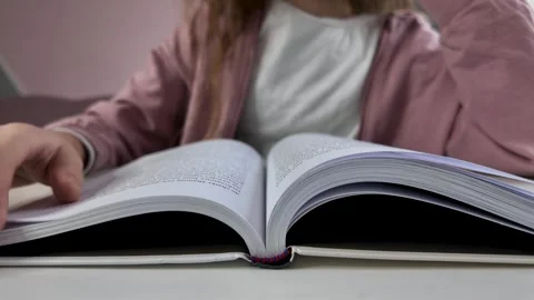 Hands flipping through workbook pages, close up Stock Footage 328420789