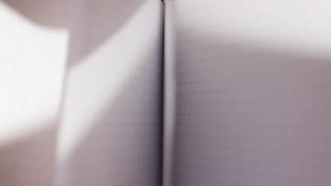 Hands flipping white pages of blank paper notebook flat lay Stock Footage 340139194