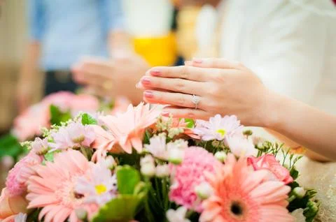 Hands with flowers Stock Photos
