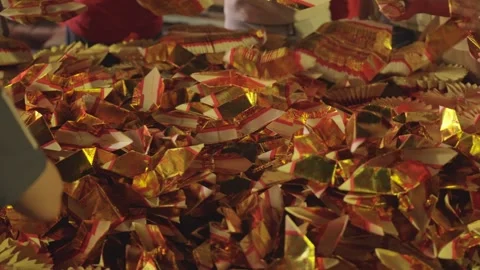 Hands Folding and Stacking Gold Joss Paper Ingots Around Offering Pile Stock Footage 346255610