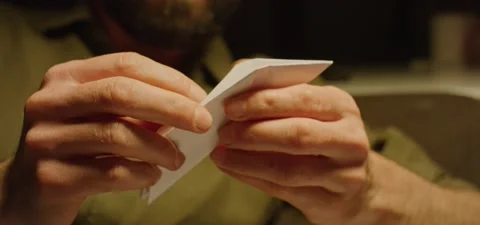 Hands folding a figure from paper Stock Footage 201143430