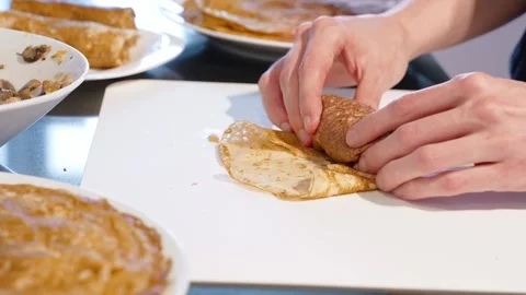 Hands Folding Filled Crepe On Kitchen Board Stock Footage 329193879