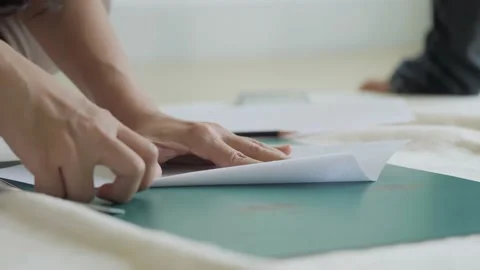 Hands folding a paper airplane. Stock Footage 165583295