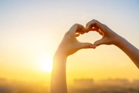 Hands in the form of heart Stock Photos