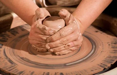 Hands forming clay Stock Photos