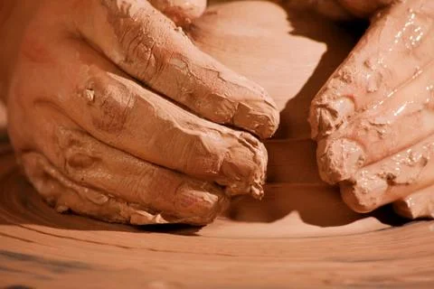 Hands forming clay Stock Photos