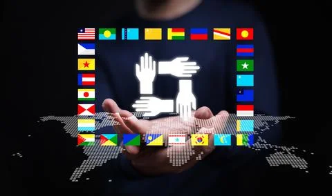 Hands forming unity symbol above world map with international flags represe.. Fotos Stock