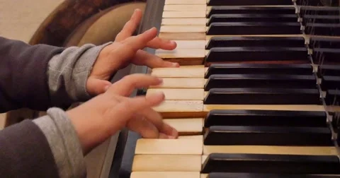 Hands of four years child playing on old piano in 4K Stock Footage 43508296