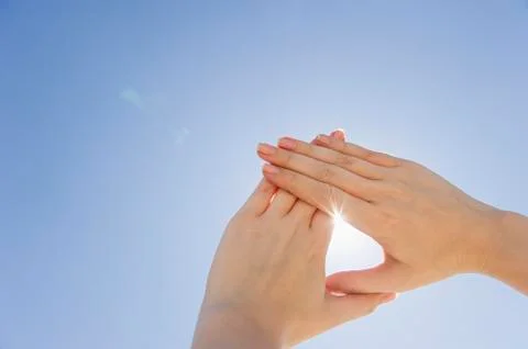 Hands framing sunshine Stock Photos