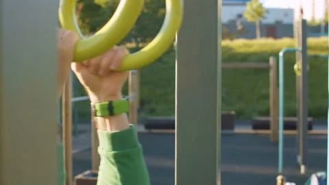 Hands of freak man pulls up on the rings Stock Footage 133953582