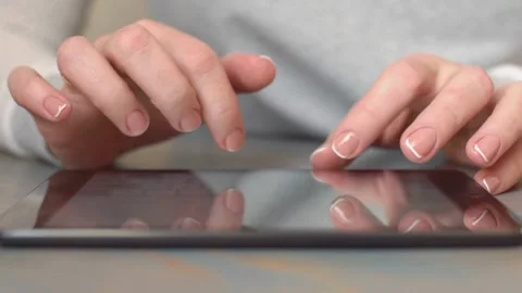Hands with french manicure using a digital tablet screen Video stock 333836686
