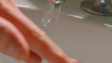 Hands with Fresh Soap Rubbing Together to Smooth into Skin to Remove Germs and Stock Footage 313249873