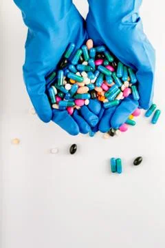 Hands full of medication. Tablets and pils Stock Photos