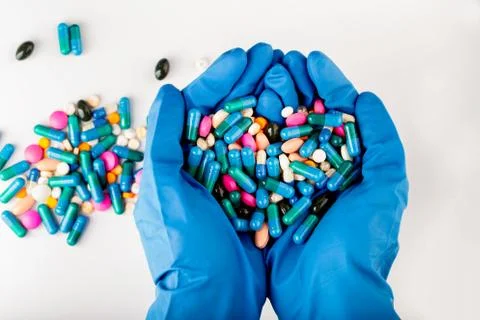 Hands full of medication. Tablets and pils Stock Photos