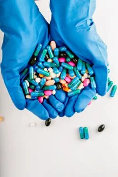 Hands full of medication. Tablets and pils Stock Photos
