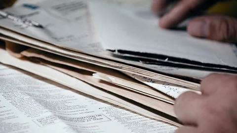 Hands gently searching through old documents and mail for single letter. Video stock 116685718