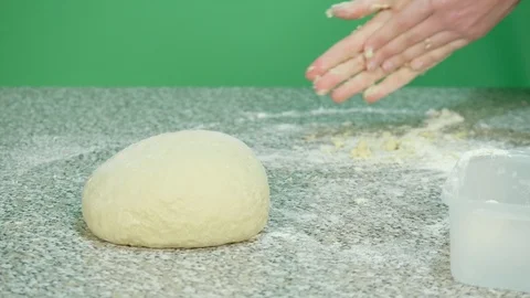 Hands gesture on background and dough for baked goods on foreground - green s Stock Footage 126608344