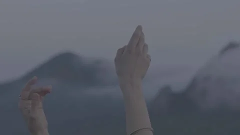 Hands gestures in background of the fogy mountains Stock Footage 165440377