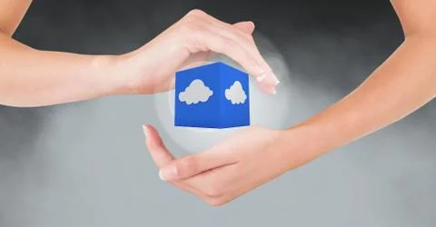 Hands gesturing against cloud computing icon in background Foto stock