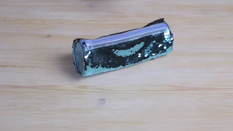 Hands get pencils out of a bluebug pencil case Video stock 104484019