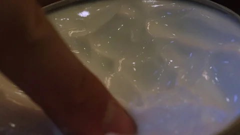 Hands getting moisturizer from container closeup Stock Footage 82824445