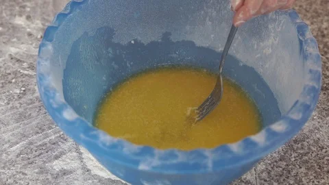 Hands girl adding sugar eggs to homemade cake baking mixing bowl Stock Footage 78483955